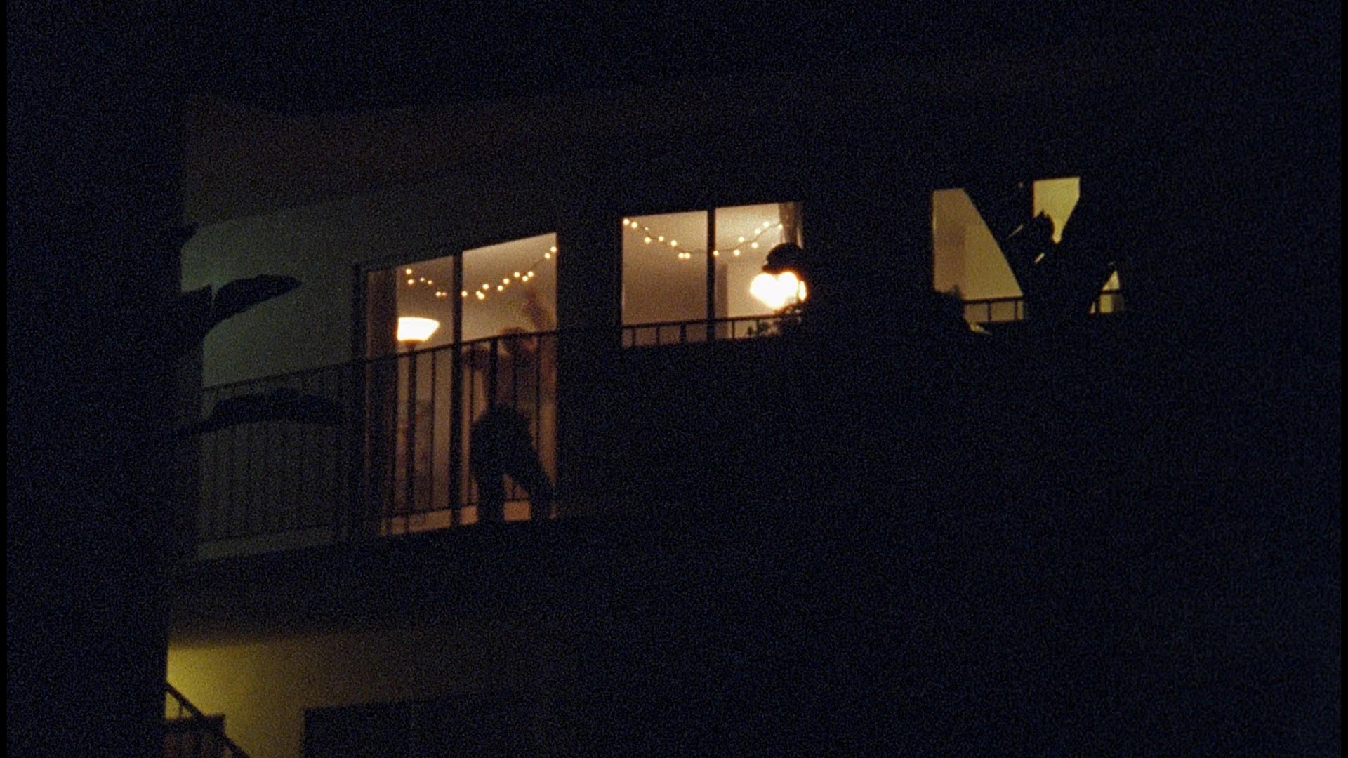 An apartment block lit at night, from the dance film Isolations, where Katie Peabody appeared as Dancer