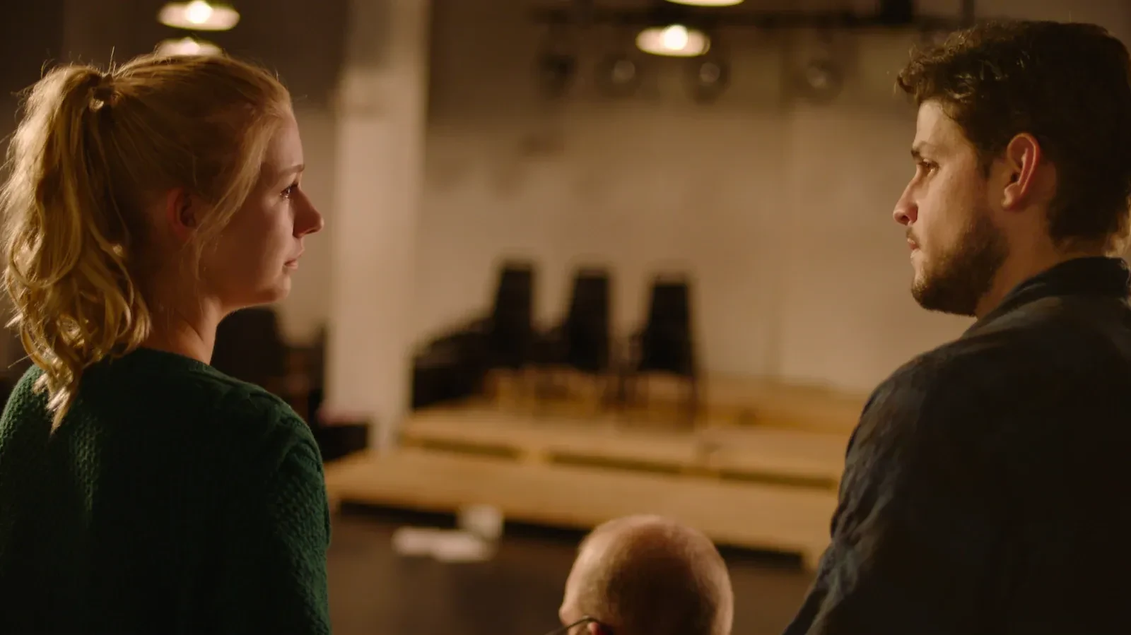 Katie Peabody as Rachel facing David Blue across a rehearsal room in the feature film Lear's Shadow