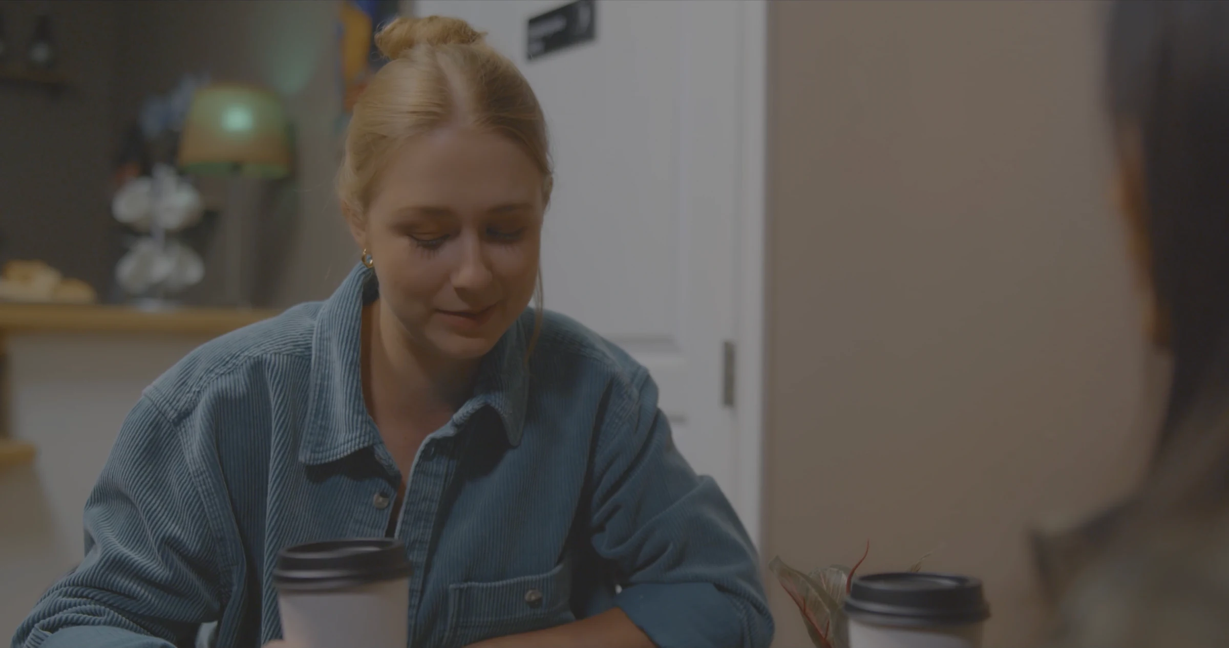 Katie Peabody as Sam in Tapestry, E3W Productions, seated at a table
