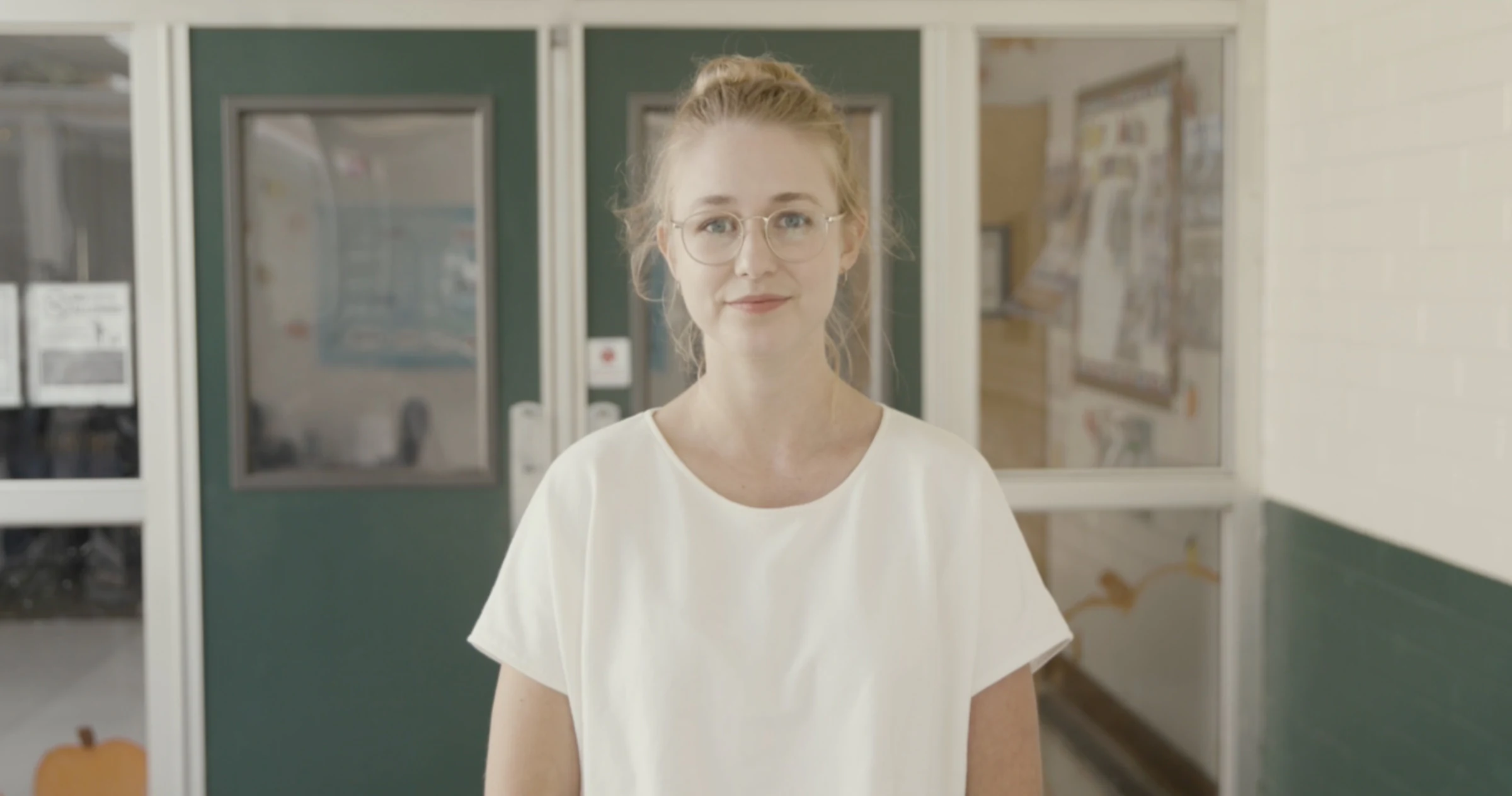 Katie Peabody in a white tee in a clinical white room, from a Caseworx film