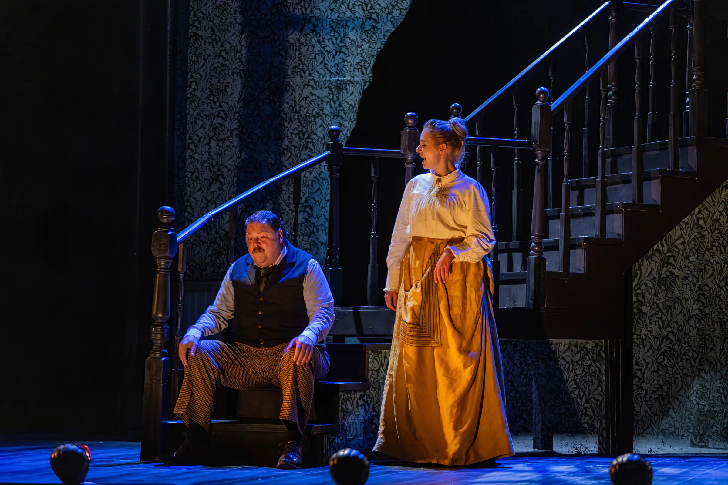 Katie Peabody as the Governess with Ben Layman on the staircase set of The Turn of the Screw at Penobscot Theater Company